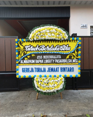 Papan Bunga Duka di Wadangku